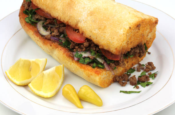 Traditional Turkish cuisine, Tantuni with loaf bread on white background
